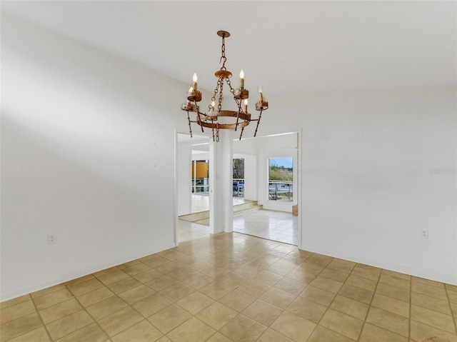 spare room featuring vaulted ceiling, light tile patterned floors, and a chandelier