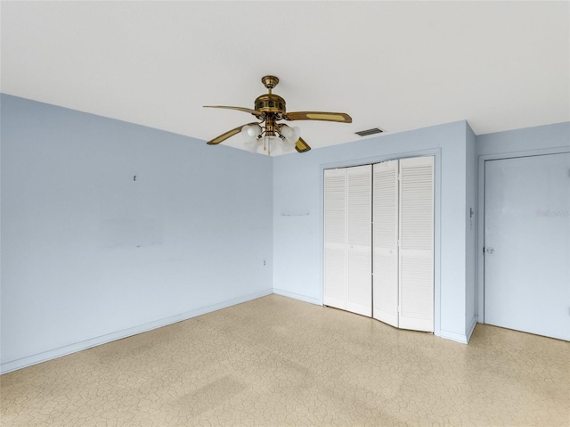 unfurnished bedroom featuring ceiling fan