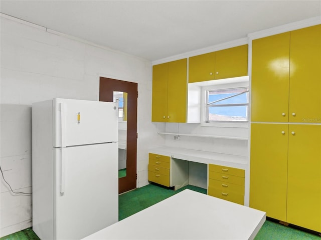 kitchen featuring dark carpet and white fridge