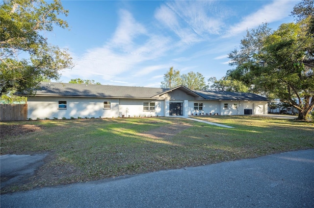 ranch-style house with a front lawn