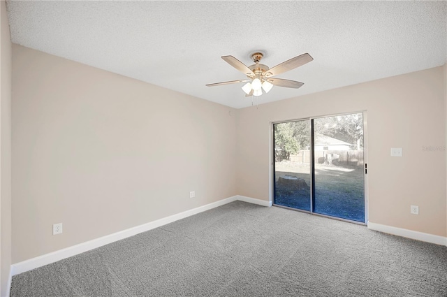 carpeted empty room with a textured ceiling and ceiling fan