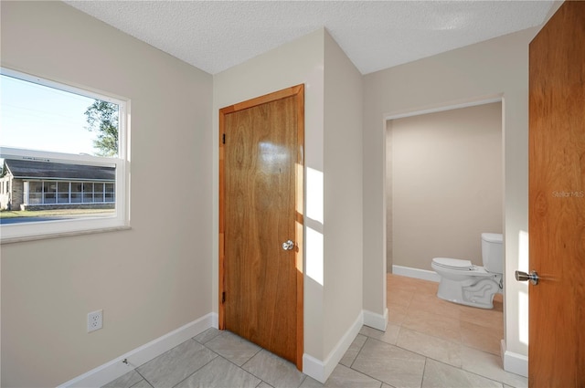 interior space featuring a textured ceiling