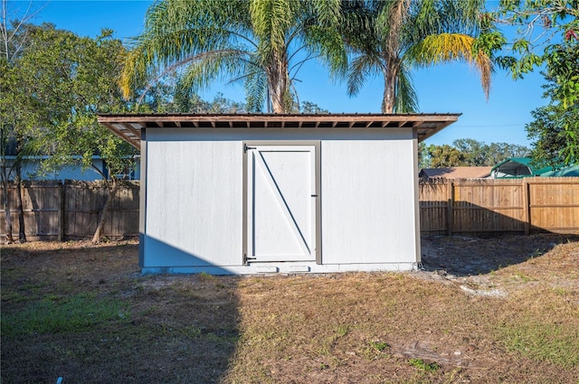 view of outdoor structure with a lawn