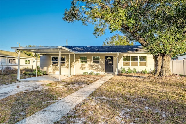 ranch-style house with a carport