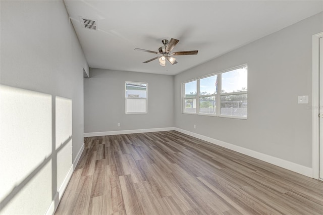 spare room featuring light wood-type flooring and ceiling fan