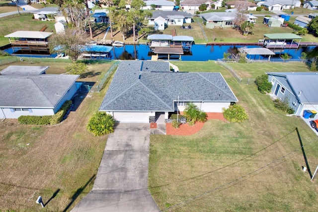 drone / aerial view with a water view