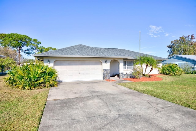 ranch-style home featuring a garage and a front lawn