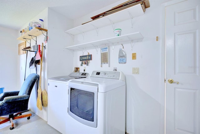 washroom featuring washer and clothes dryer