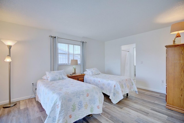 bedroom with light hardwood / wood-style floors