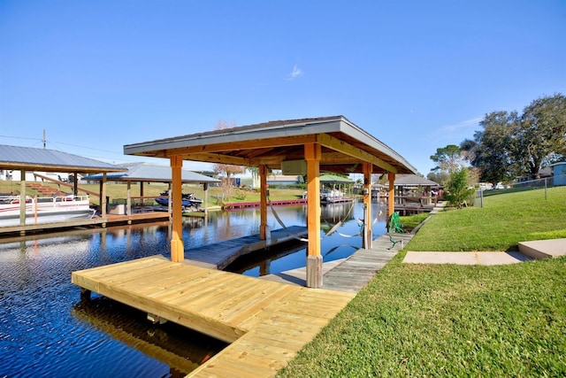 view of dock featuring a yard and a water view