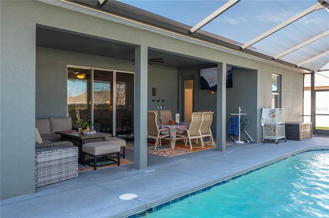 view of swimming pool featuring a lanai and a patio area