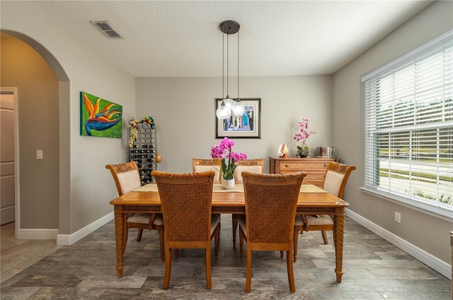 dining area with wood-type flooring