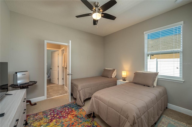 bedroom featuring light carpet and ceiling fan