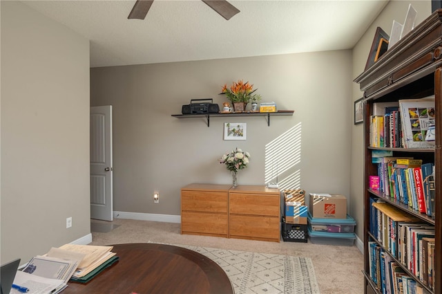 carpeted office with ceiling fan