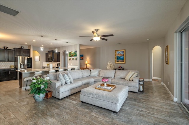 living room with ceiling fan