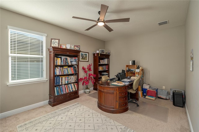 office space featuring ceiling fan, lofted ceiling, and light carpet