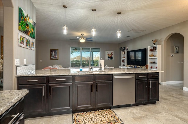 kitchen with hanging light fixtures, dishwasher, sink, and dark brown cabinetry