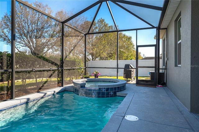 view of swimming pool with a lanai and an in ground hot tub