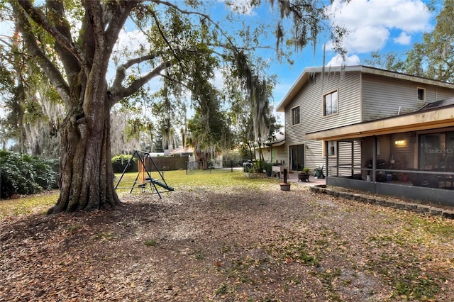 view of yard with a sunroom