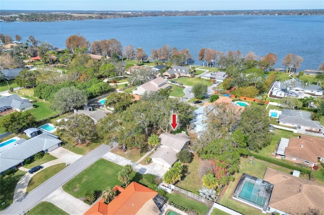 birds eye view of property with a water view