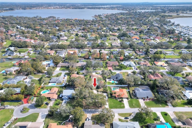 birds eye view of property featuring a water view