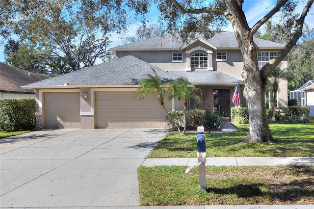 view of property with a garage and a front yard