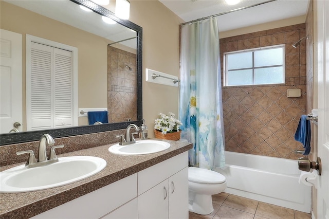 full bathroom with vanity, toilet, tile patterned floors, and shower / tub combo with curtain