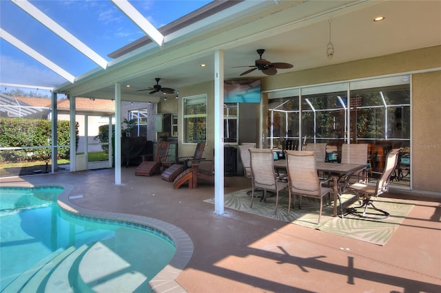 exterior space with ceiling fan, a patio, and glass enclosure