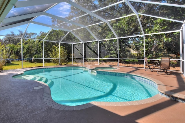 view of swimming pool with a patio area and an in ground hot tub