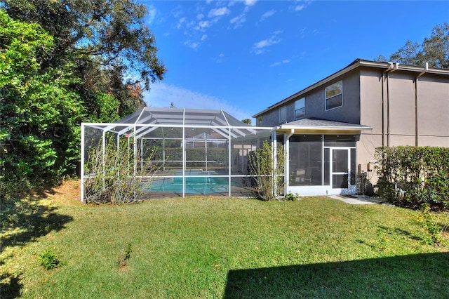 view of yard featuring a lanai and a sunroom