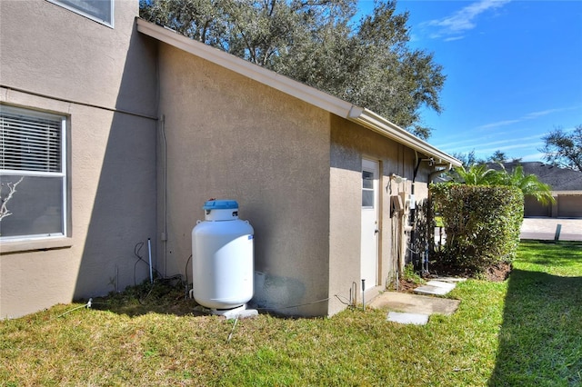 view of home's exterior featuring a lawn