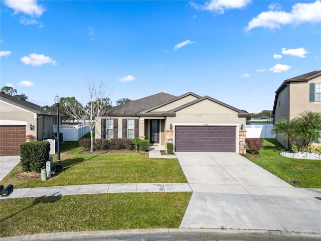 view of front of house featuring a front lawn and a garage