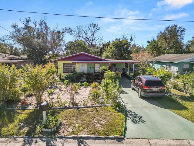 ranch-style home with a carport