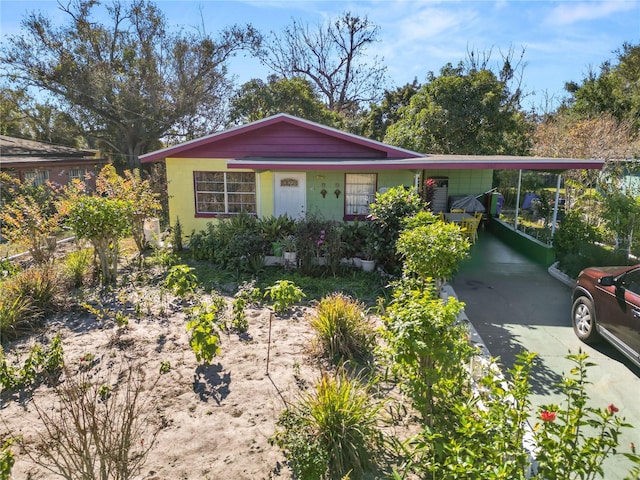 single story home featuring a carport