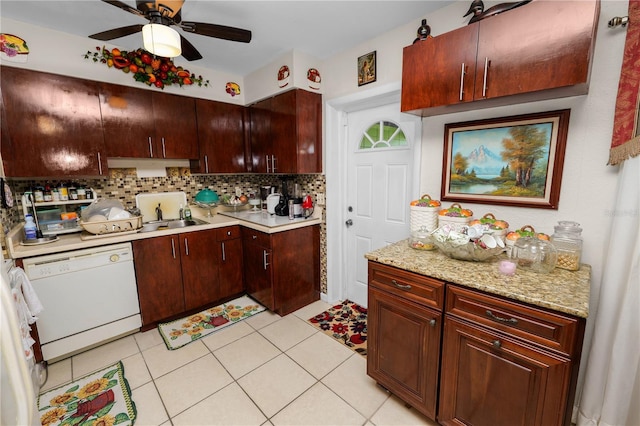 kitchen featuring ceiling fan, sink, white dishwasher, decorative backsplash, and light tile patterned floors