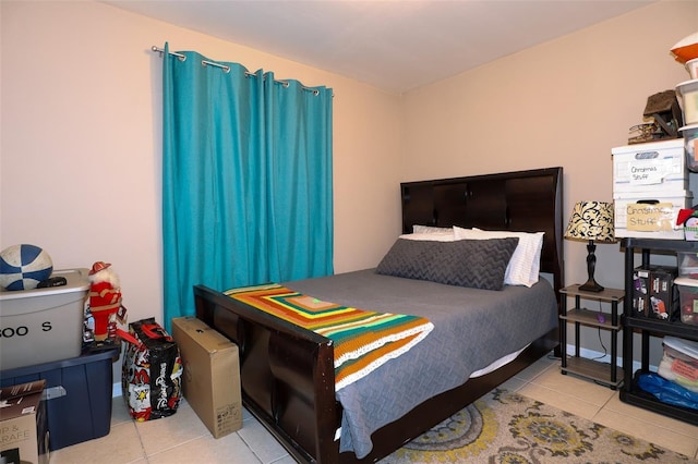 bedroom with light tile patterned flooring