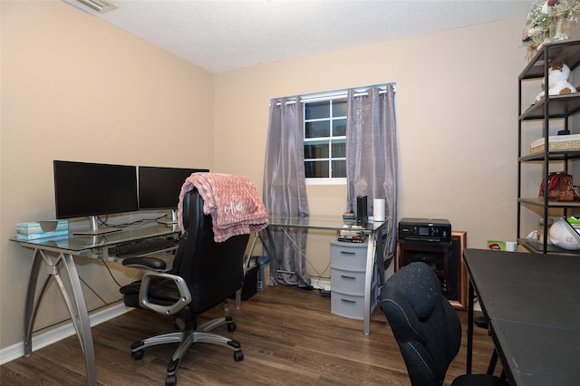 office space featuring a textured ceiling and dark hardwood / wood-style floors