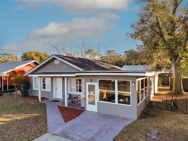 rear view of house featuring a patio