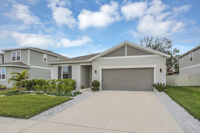 view of front of house with a front lawn and a garage