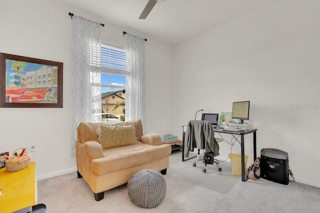 office area with ceiling fan and light colored carpet