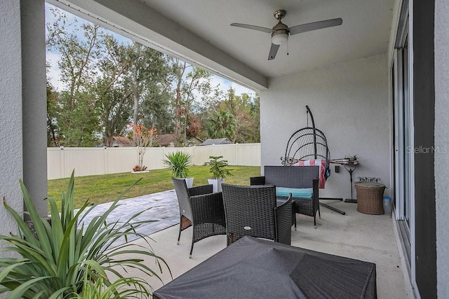 view of patio with ceiling fan and an outdoor hangout area