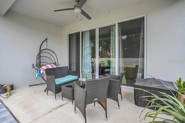 view of patio featuring ceiling fan