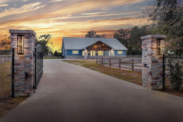 view of gate at dusk