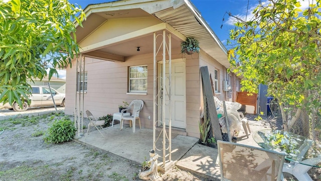 property entrance with a patio