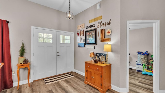 entryway with hardwood / wood-style flooring