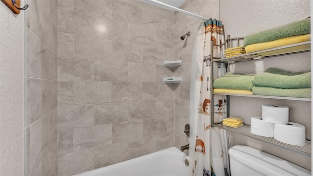 bathroom with shower / bath combination with curtain and toilet