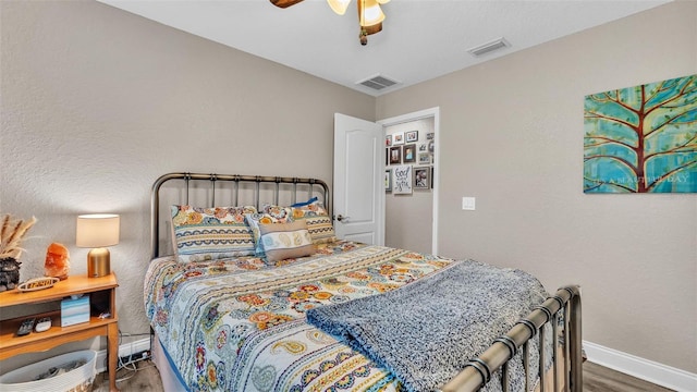 bedroom featuring ceiling fan and hardwood / wood-style flooring