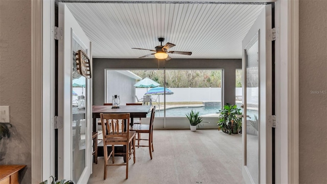 sunroom / solarium with ceiling fan