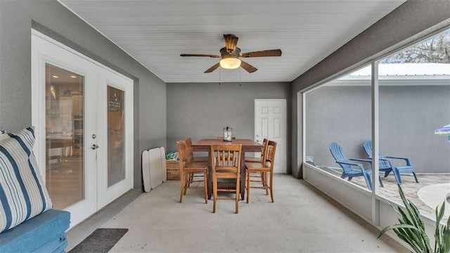 sunroom / solarium with ceiling fan and french doors