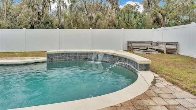 view of swimming pool with pool water feature